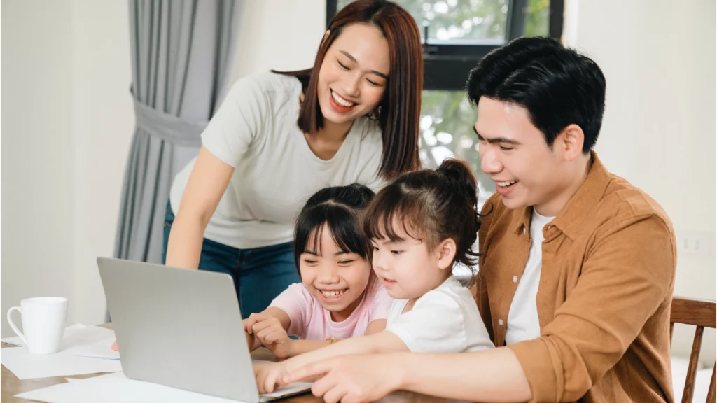 Young family planning out their budget together.